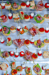 slicing vegetables in portions on a buffet table top view
