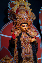 Goddess Laxmi, Durga Puja festival at night. Shot under colored light at Howrah, West Bengal, India.