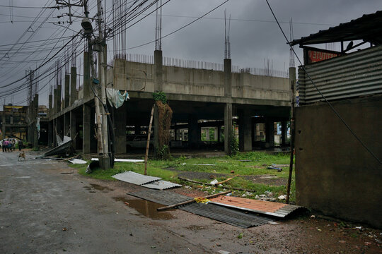 Howrah, West Bengal, India - 21st May 2020 : Super cyclone Amphan destructed aluminium sheets used in a newly constructed building. The sheets are lying on road as a sign of devastation.