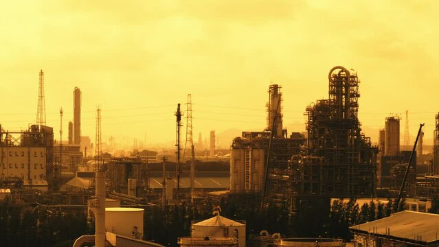 Petrochemical plant on sunset sky background