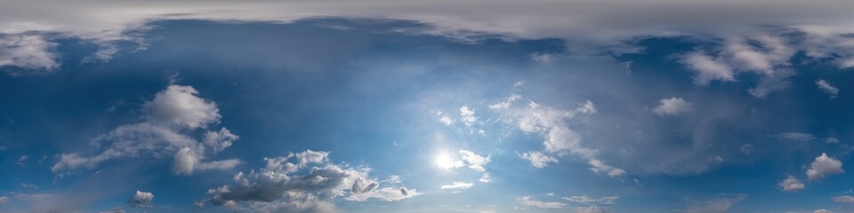 Blue sky panorama with Cirrus clouds in Seamless spherical equirectangular format. Full zenith for use in 3D graphics, game and editing aerial drone 360 degree panoramas for sky replacement.