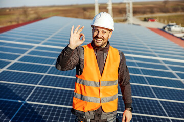 A worker gesturing with hand with okay sign for sustainable lifestyle.