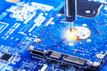 Production line of  electronics factory. Process connection microchips to the motherboard.