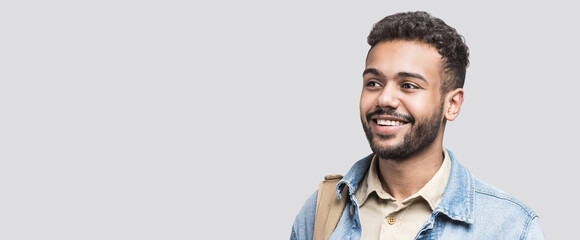 Closeup portrait of handsome smiling young man. Laughing joyful cheerful men isolated studio shot. Panoramic banner
