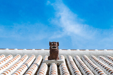 Shisa symbol of Okinawa Lion on original Ryukyu architecture roof art Okinawa island Japan