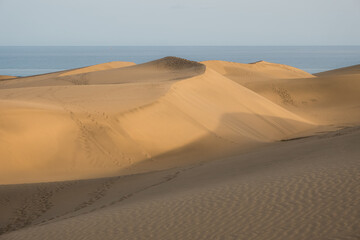 Fototapeta na wymiar Girl exploring some sand dunes