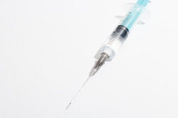 Medical syringe on a white background. A syringe for injection. The concept of health and beauty