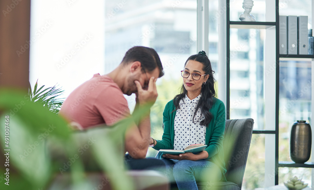 Poster failure hurts, but with help it doesnt have to. shot of a young man crying while having a discussion
