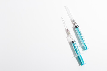 Medical syringe on a white background. A syringe for injection. The concept of health and beauty