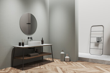 Light bathroom interior with douche and sink with mirror