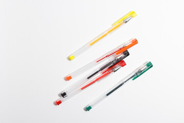 colored gel pens for writing on a white background