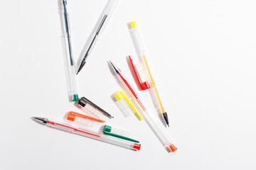 colored gel pens for writing on a white background