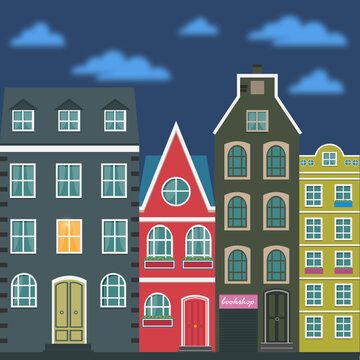  Amsterdam cute colourful houses in the night time with clouds