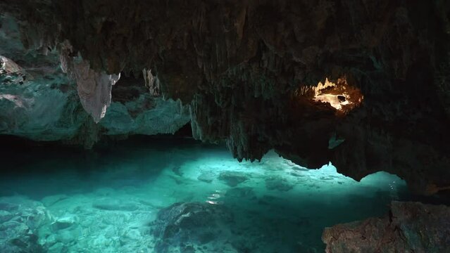 Underwater caves of Yucatan Mexico cenotes. Tourism and nature concept. Cave diving in clean and clear underground water. High quality 4k footage