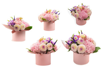 Pink and purple bouquet of flowers in a pink box isolated on white.