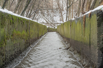 Drainage ditch collector for drainage of surface and flood water and snow.