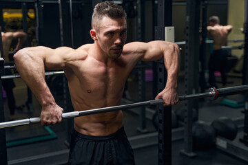 Obraz na płótnie Canvas Close up of athletic man building muscles
