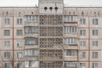 Facade of an old Soviet high-rise panel apartment building, close-up. © Dmytro