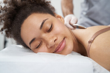 Close-up photo of female on massage session