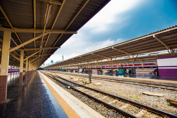 Fototapeta na wymiar Railroad tracks and platforms with railway station roofs