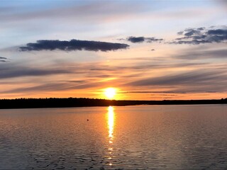 Naklejka premium sunset over the river