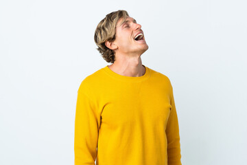 English man over isolated white background laughing