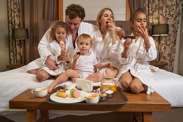 Children and parents eating together in the hotel