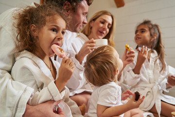 Young family spending time together while eating