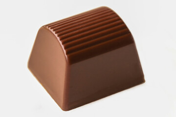 Milk chocolate cubes isolated on white background