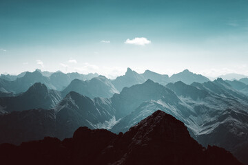 silhouette of mountains in the morning with haze and fog