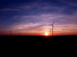 Fototapeta na wymiar Wind turbines sunset