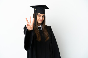 Young university graduate isolated on white background happy and counting three with fingers