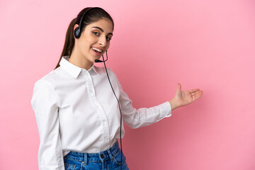 Young telemarketer over isolated background extending hands to the side for inviting to come
