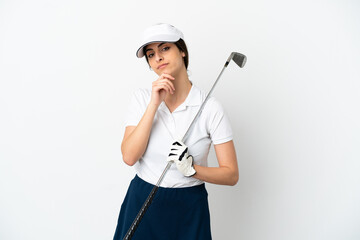 Handsome young golfer player woman isolated on white background thinking