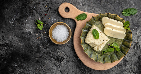 halloumi cheese with mint. Cheese for grilling, Cyprus squeaky cheese. banner, menu, recipe place for text,