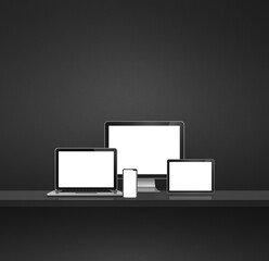 Computer, laptop, mobile phone and digital tablet pc. Black shelf background
