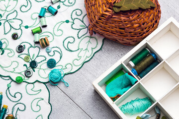 Sewing and embroidery supplies on a  table, horizonthal.