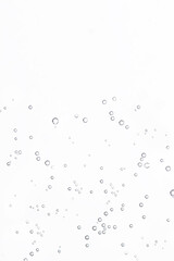 Fizzing air bubbles on white background. Fizzy water background, abstract bubbles.