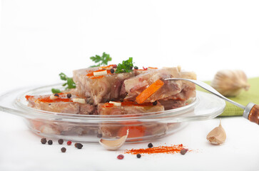 Pihtije - serbian traditional dish - aspic with pork meat and vegetables. Meat jelly - holodets, pihtija or galareta on white background.