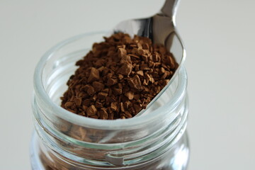 Granular instant coffee in the spoon