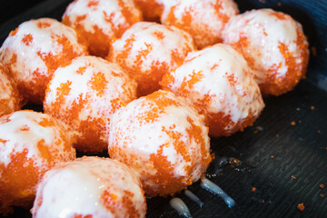 Rice ball with Ebiko (red caviar). Japanese food style.