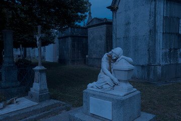 Cemetery sad woman statue