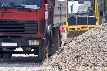 Heavy construction truck outdoors for public place reconstruction.