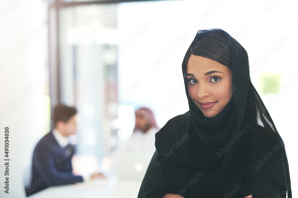 Wall mural time to make it work. portrait of a confident young muslim businesswoman working in a modern office 