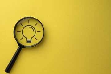 Creativity idea and innovation,Search a new idea or good idea concept.,Magnifying glass with light...
