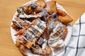 Italian Carnival sweets. Sfrappole or chiacchiere - traditional sweet crisp pastry deep-fried...