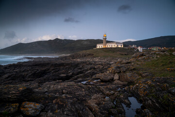 Fototapeta na wymiar Lighthouse on the coastof Galicia. Lariño lighthouse, Carnota, Spain