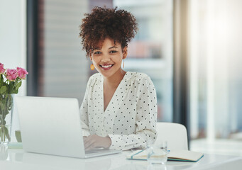 Success is her game. Shot of a beautiful young businesswoman working in her office.