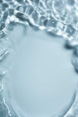 Soft focus lite gray cosmetic moisturizer floral water, micellar toner, or emulsion abstract background. Reflections of  scattered sun texture.