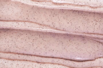 Cosmetic cream scrub for face, body or scalp. Texture background. Fogy pink cream